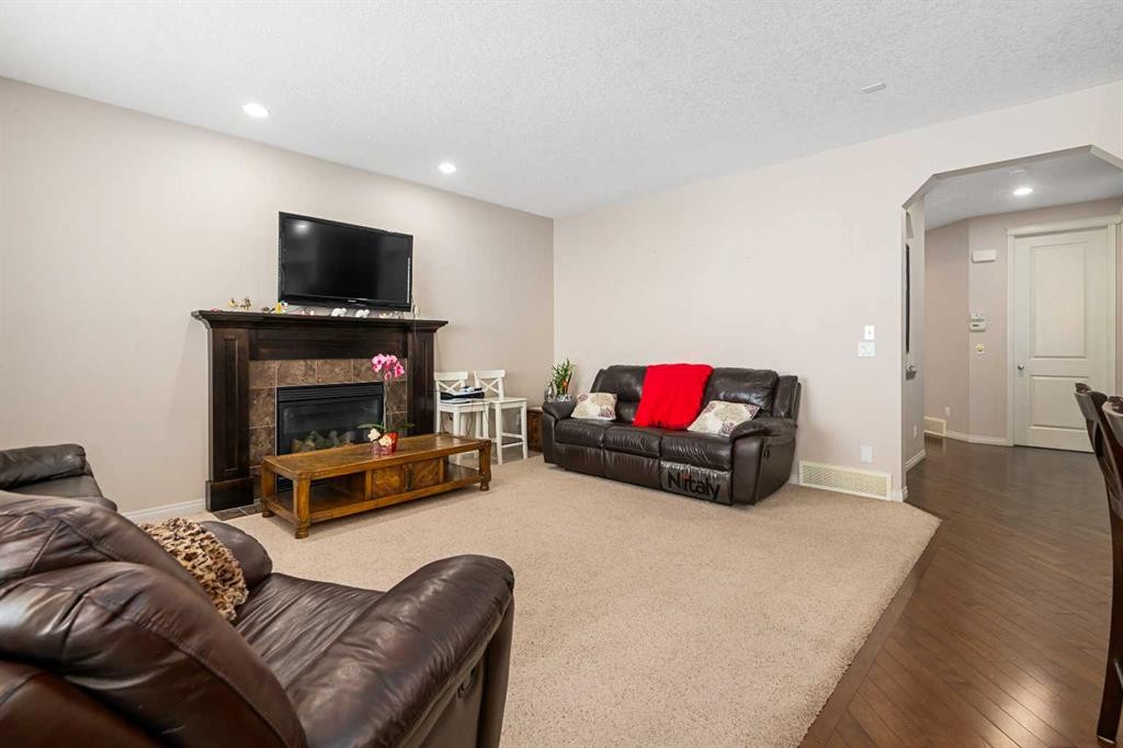 79 Pantego Way Nw, Calgary, AB - Indoor Photo Showing Living Room With Fireplace