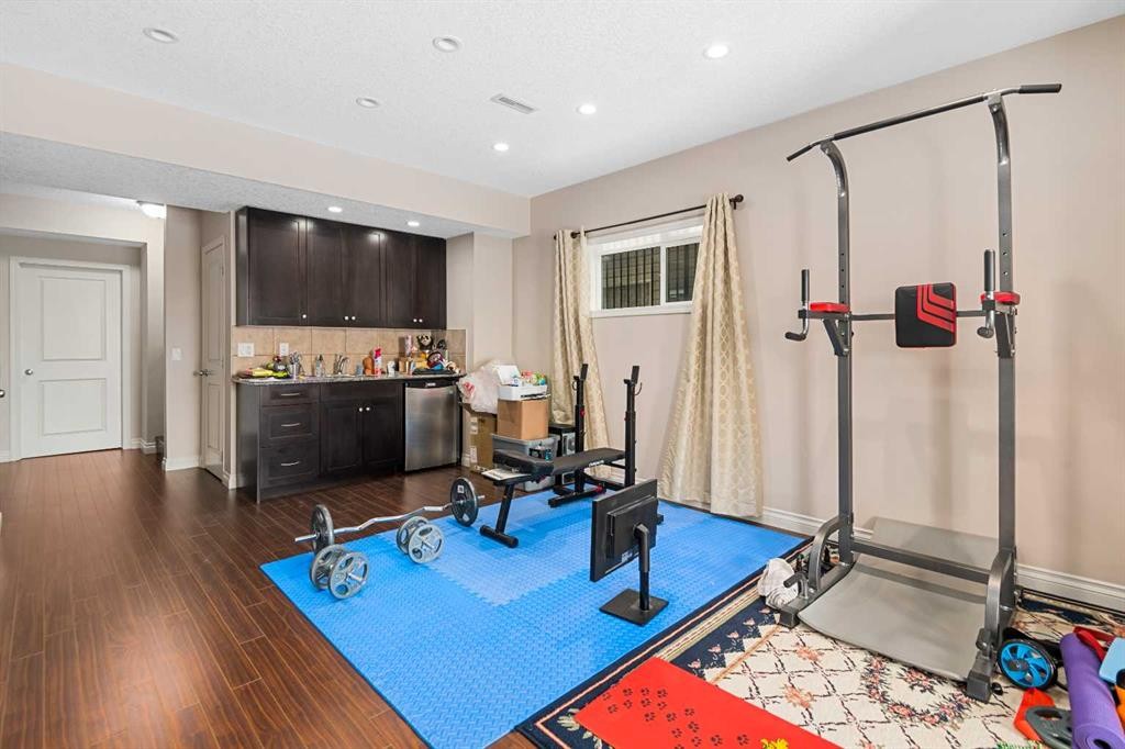 79 Pantego Way Nw, Calgary, AB - Indoor Photo Showing Gym Room