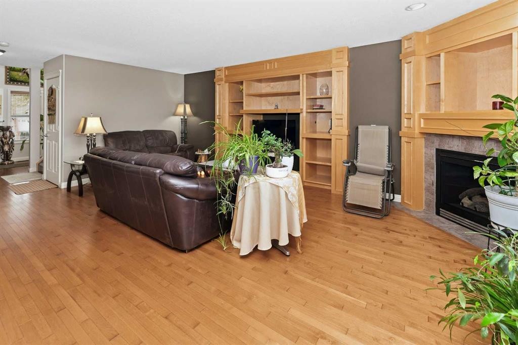 50 Panamount View Nw, Calgary, AB - Indoor Photo Showing Living Room With Fireplace