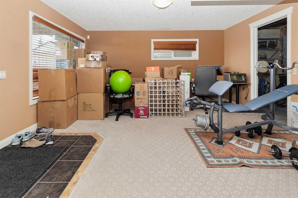 50 Panamount View Nw, Calgary, AB - Indoor Photo Showing Gym Room