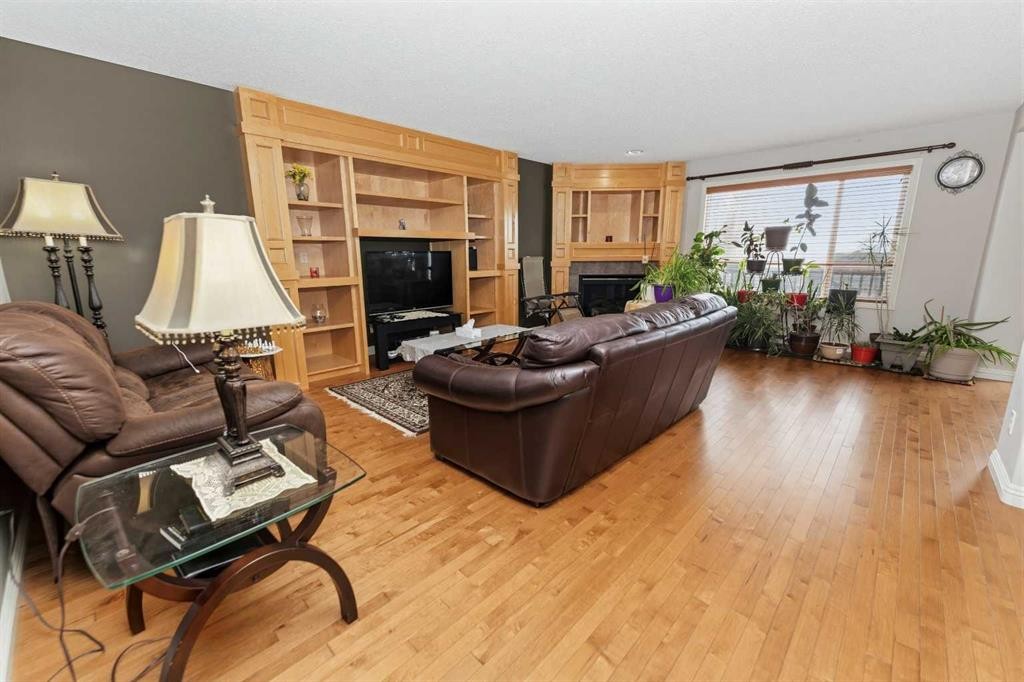 50 Panamount View Nw, Calgary, AB - Indoor Photo Showing Living Room With Fireplace