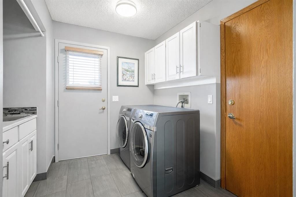 135 Canter Place Sw, Calgary, AB - Indoor Photo Showing Laundry Room