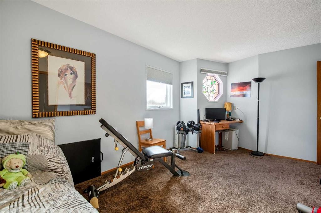 135 Canter Place Sw, Calgary, AB - Indoor Photo Showing Bedroom