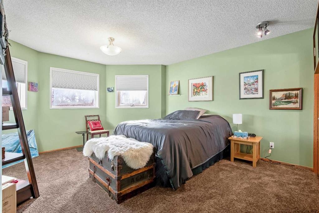 135 Canter Place Sw, Calgary, AB - Indoor Photo Showing Bedroom