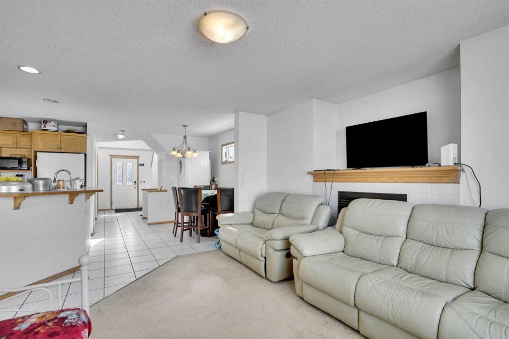 162 Taradale Drive Ne, Calgary, AB - Indoor Photo Showing Living Room