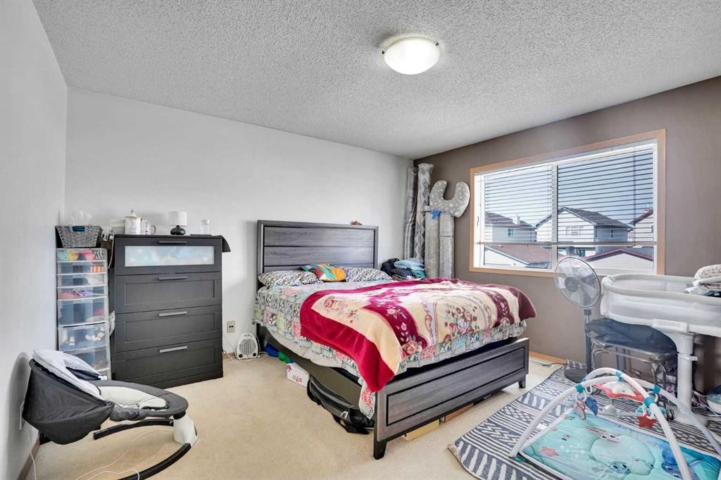 162 Taradale Drive Ne, Calgary, AB - Indoor Photo Showing Bedroom