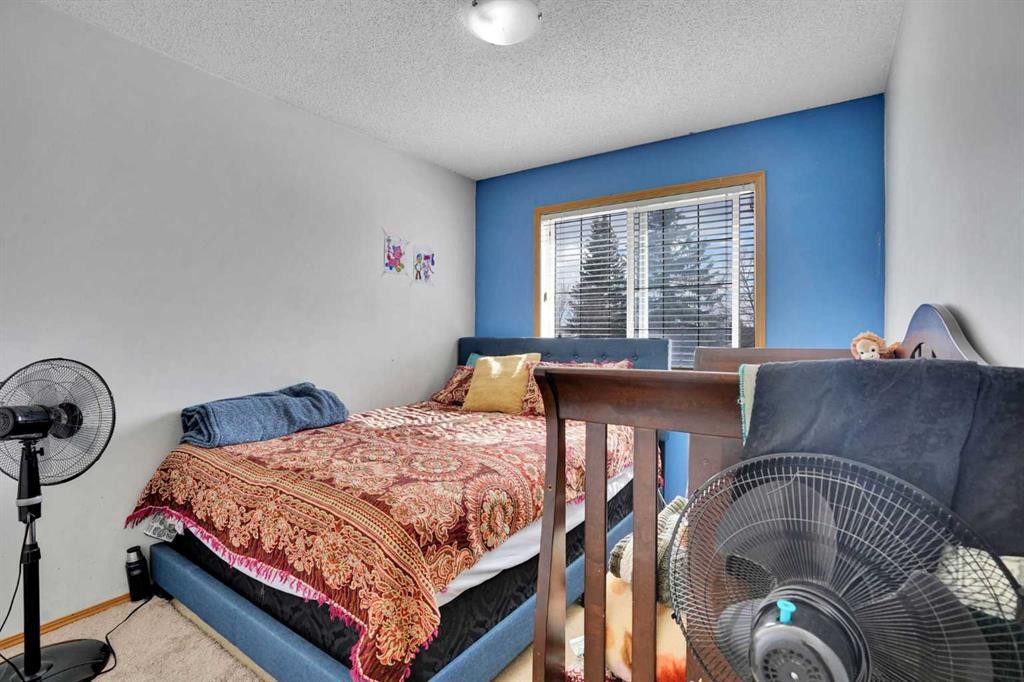 162 Taradale Drive Ne, Calgary, AB - Indoor Photo Showing Bedroom