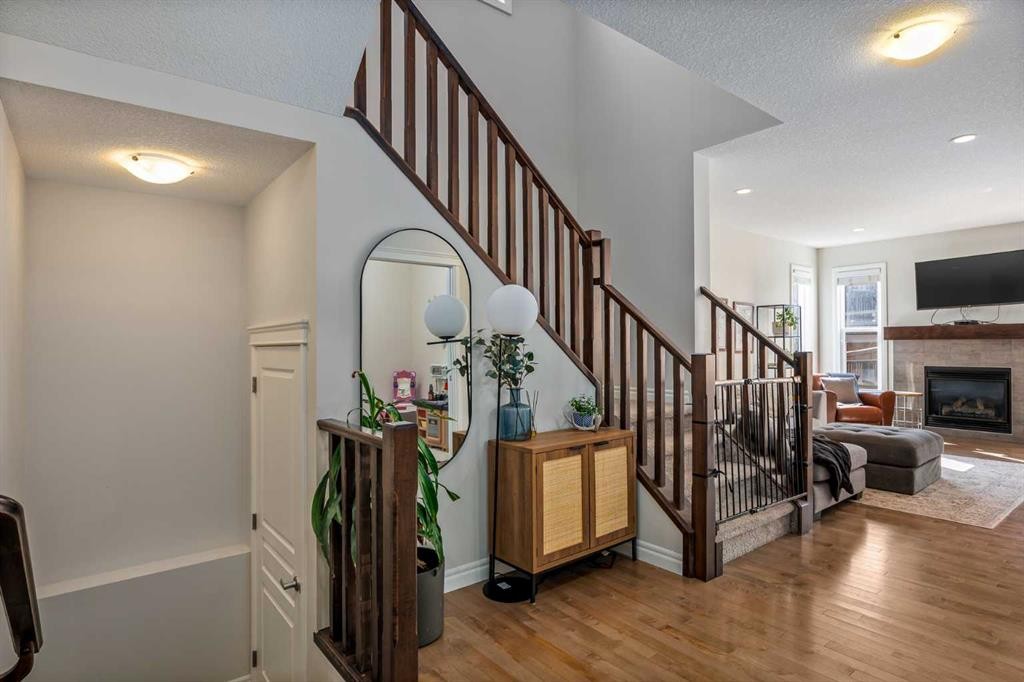 192 Nolanhurst Heights Nw, Calgary, AB - Indoor Photo Showing Other Room With Fireplace