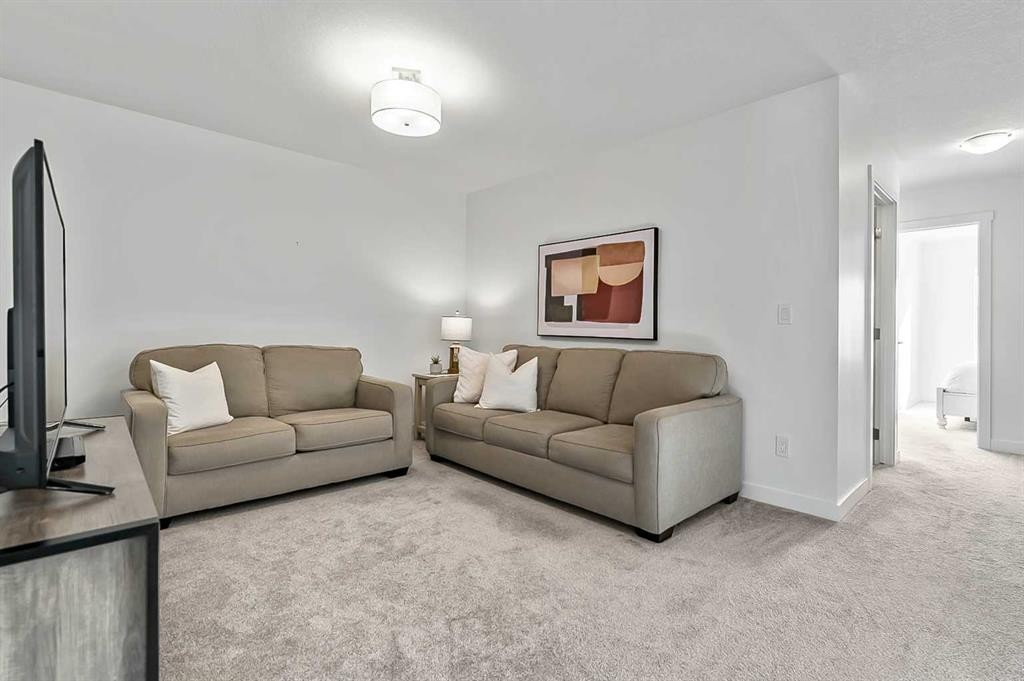 882 Bluerock Way Sw, Calgary, AB - Indoor Photo Showing Living Room