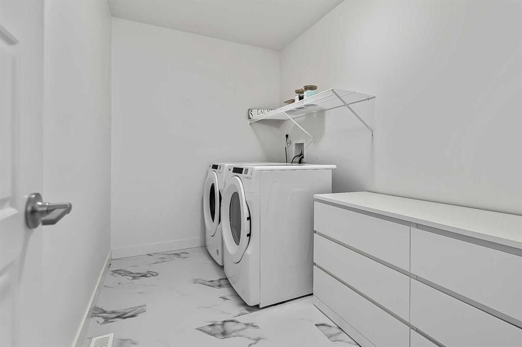 882 Bluerock Way Sw, Calgary, AB - Indoor Photo Showing Laundry Room