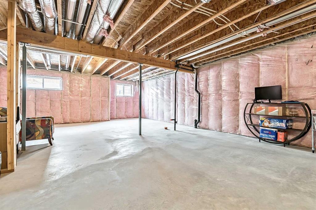 882 Bluerock Way Sw, Calgary, AB - Indoor Photo Showing Basement
