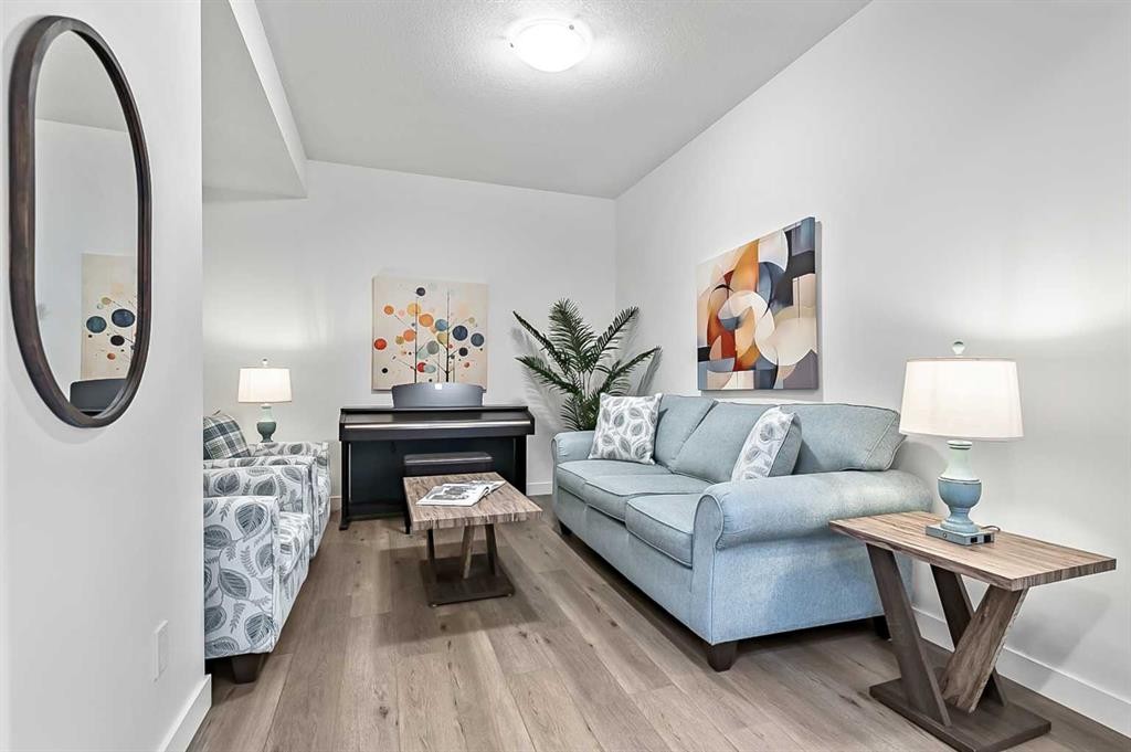 882 Bluerock Way Sw, Calgary, AB - Indoor Photo Showing Living Room