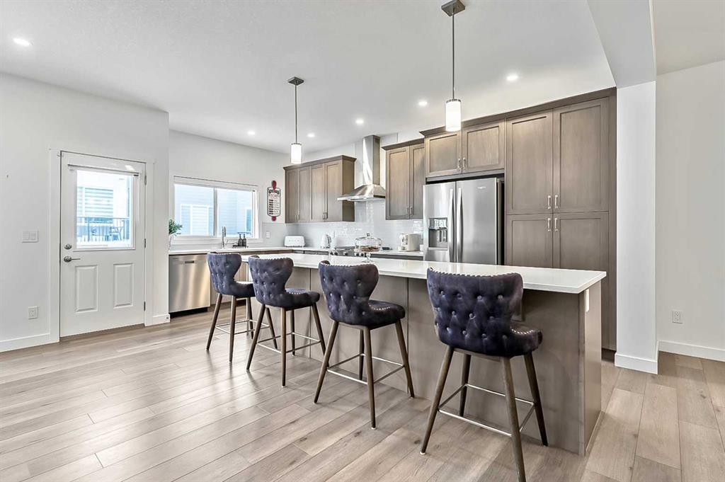 882 Bluerock Way Sw, Calgary, AB - Indoor Photo Showing Kitchen With Upgraded Kitchen