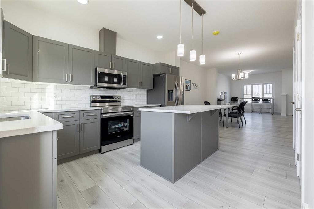713 Clearview Green, Chestermere, AB - Indoor Photo Showing Kitchen With Upgraded Kitchen