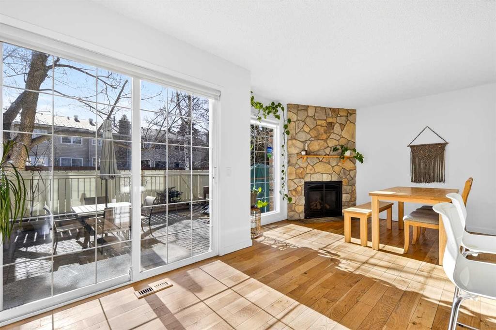 77 Point Drive Nw, Calgary, AB - Indoor Photo Showing Living Room With Fireplace