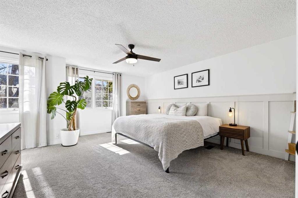 77 Point Drive Nw, Calgary, AB - Indoor Photo Showing Bedroom