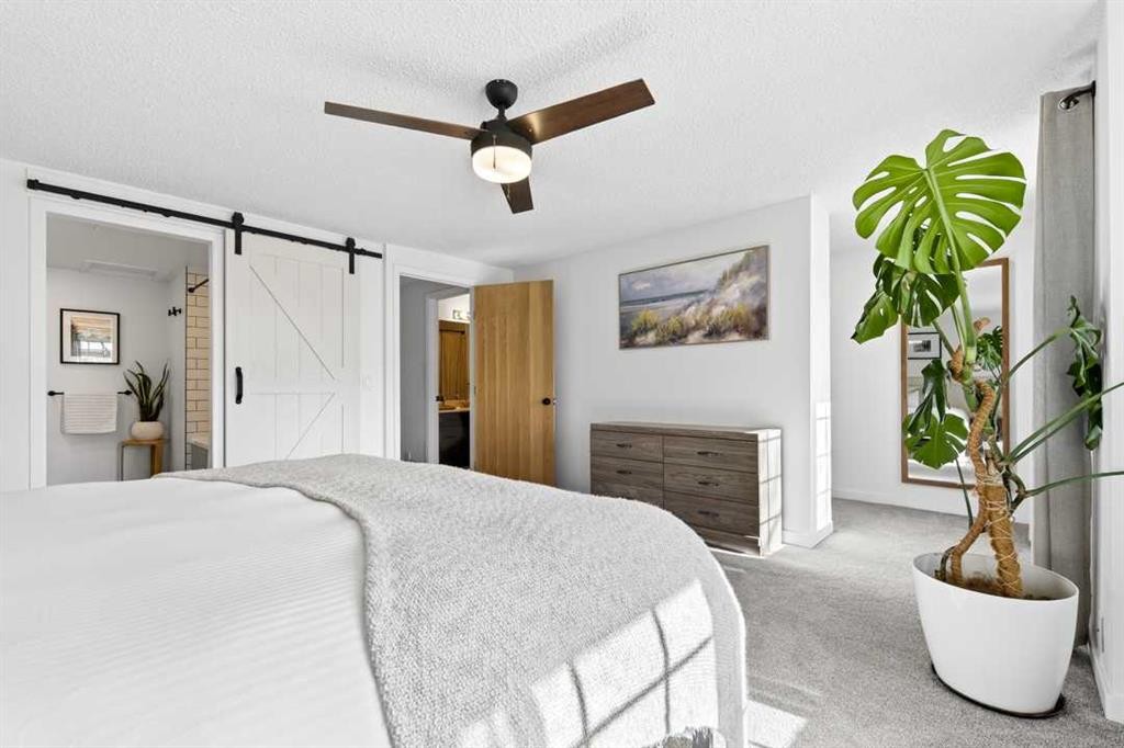 77 Point Drive Nw, Calgary, AB - Indoor Photo Showing Bedroom