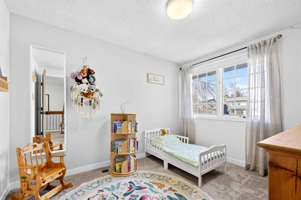 77 Point Drive Nw, Calgary, AB - Indoor Photo Showing Bedroom