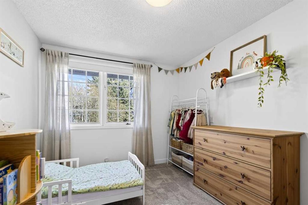 77 Point Drive Nw, Calgary, AB - Indoor Photo Showing Bedroom