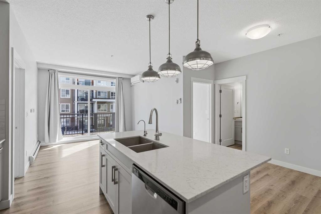 213-20 Walgrove Walk Se, Calgary, AB - Indoor Photo Showing Kitchen With Double Sink With Upgraded Kitchen