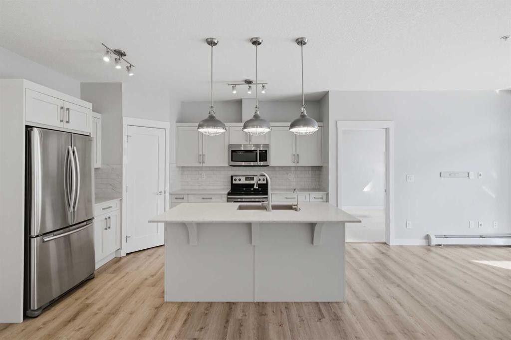 213-20 Walgrove Walk Se, Calgary, AB - Indoor Photo Showing Kitchen With Stainless Steel Kitchen With Upgraded Kitchen