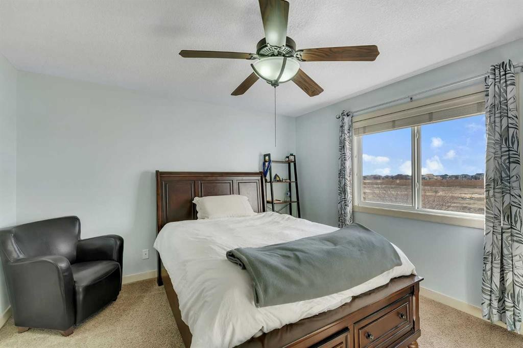 156 Bishop Crescent Nw, Langdon, AB - Indoor Photo Showing Bedroom