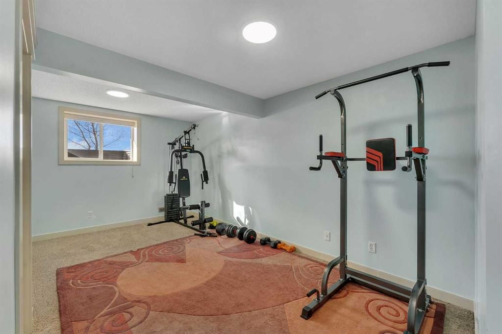 156 Bishop Crescent Nw, Langdon, AB - Indoor Photo Showing Gym Room