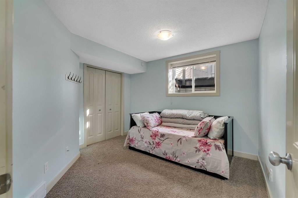 156 Bishop Crescent Nw, Langdon, AB - Indoor Photo Showing Bedroom