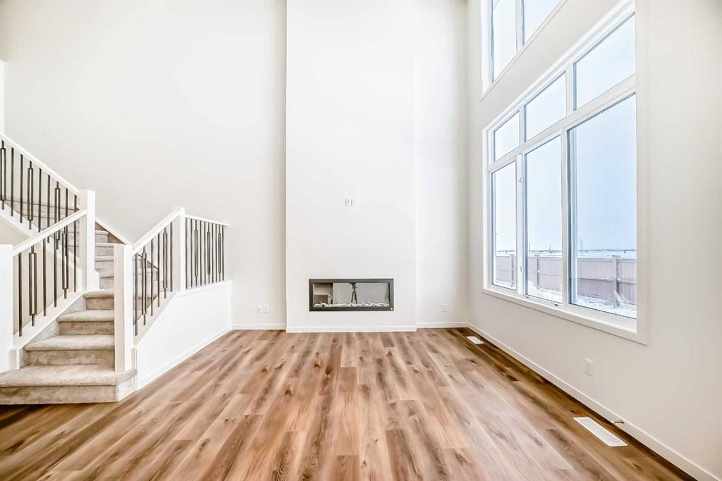 23 Bartlett Crescent Se, Calgary, AB - Indoor Photo Showing Other Room With Fireplace