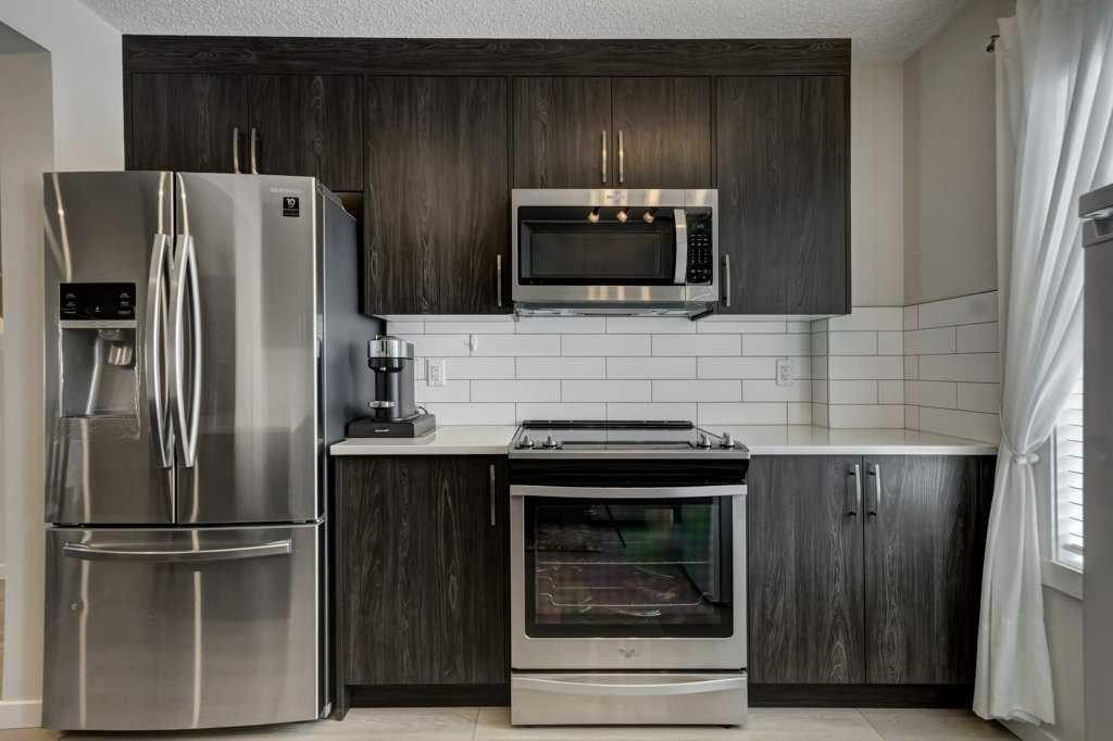 210 Cranbrook Square Se, Calgary, AB - Indoor Photo Showing Kitchen With Stainless Steel Kitchen
