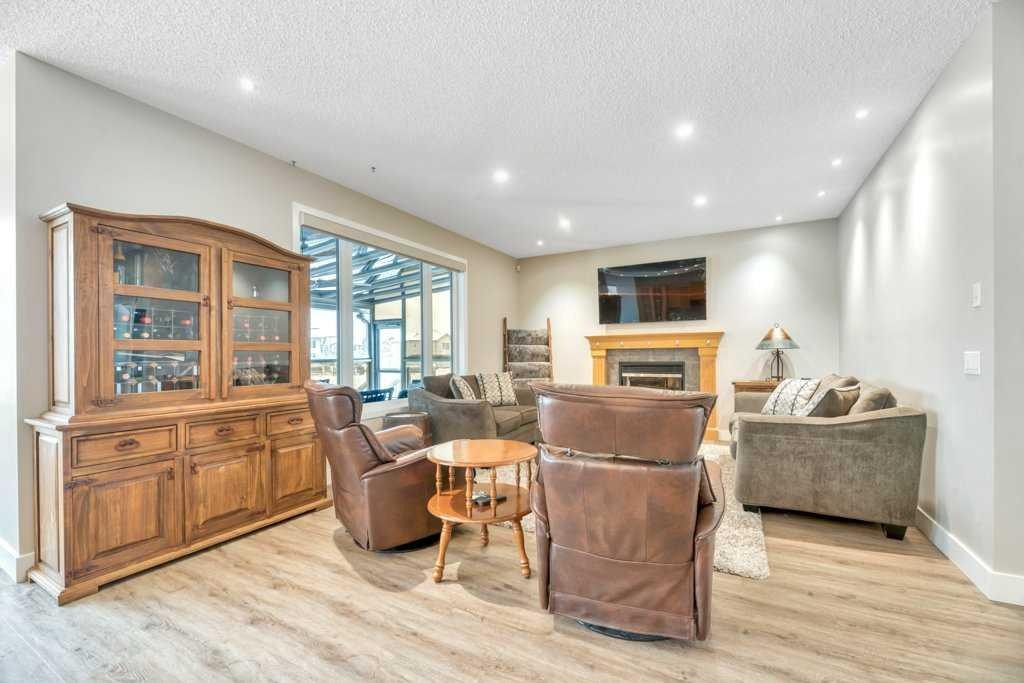 392 Rainbow Falls Way, Chestermere, AB - Indoor Photo Showing Living Room With Fireplace
