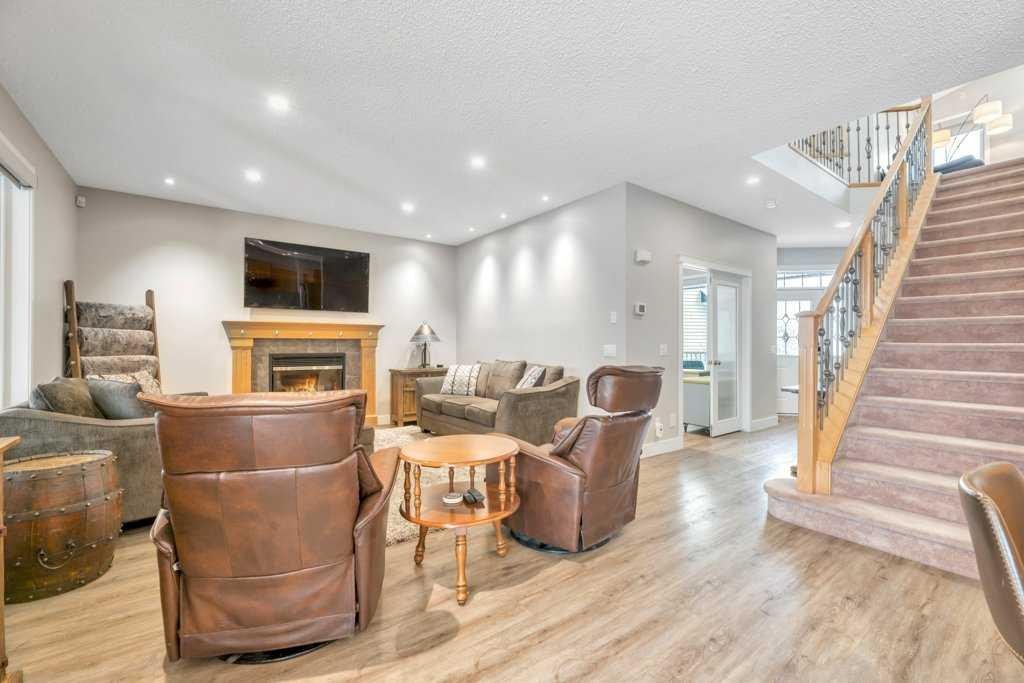 392 Rainbow Falls Way, Chestermere, AB - Indoor With Fireplace