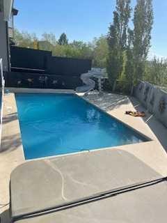 392 Rainbow Falls Way, Chestermere, AB - Outdoor With In Ground Pool