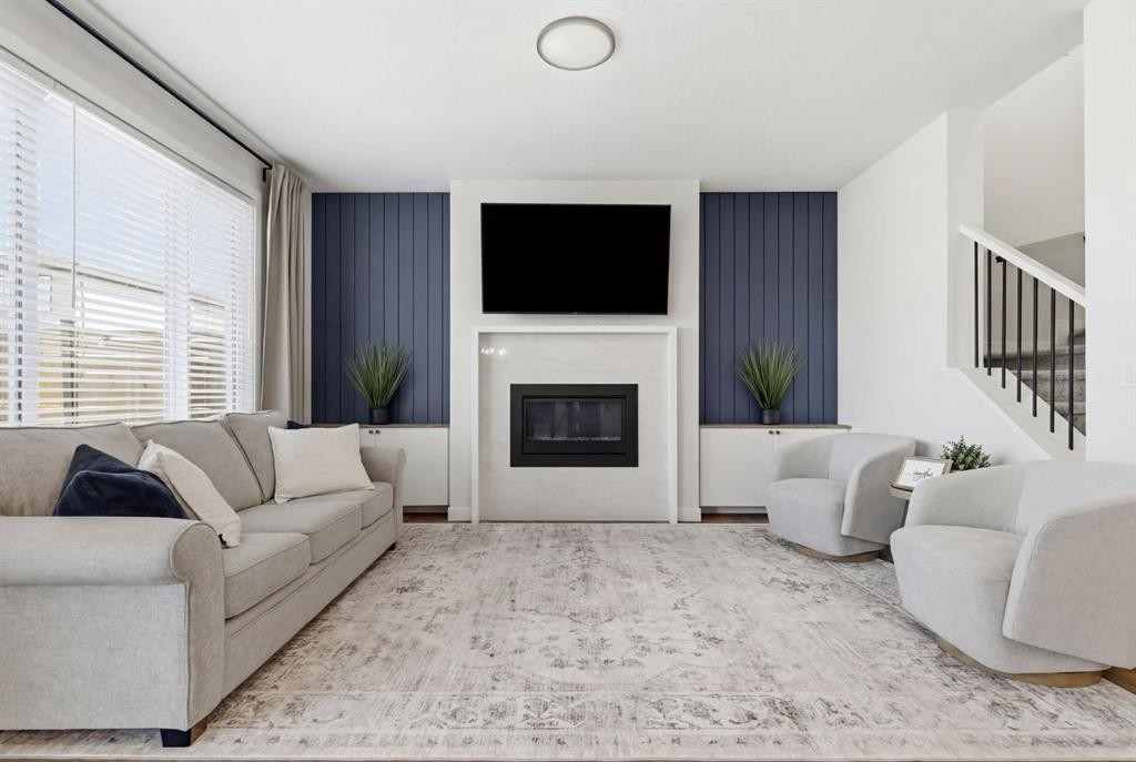 117 Ranchers View, Okotoks, AB - Indoor Photo Showing Living Room With Fireplace