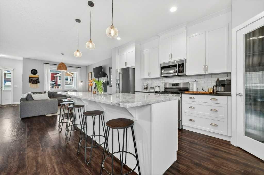 92 Fireside Crescent, Cochrane, AB - Indoor Photo Showing Kitchen With Upgraded Kitchen