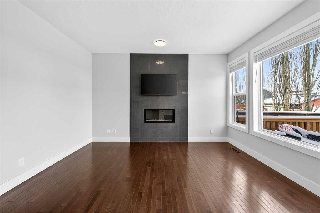 14 Evansfield Road Nw, Calgary, AB - Indoor Photo Showing Other Room With Fireplace