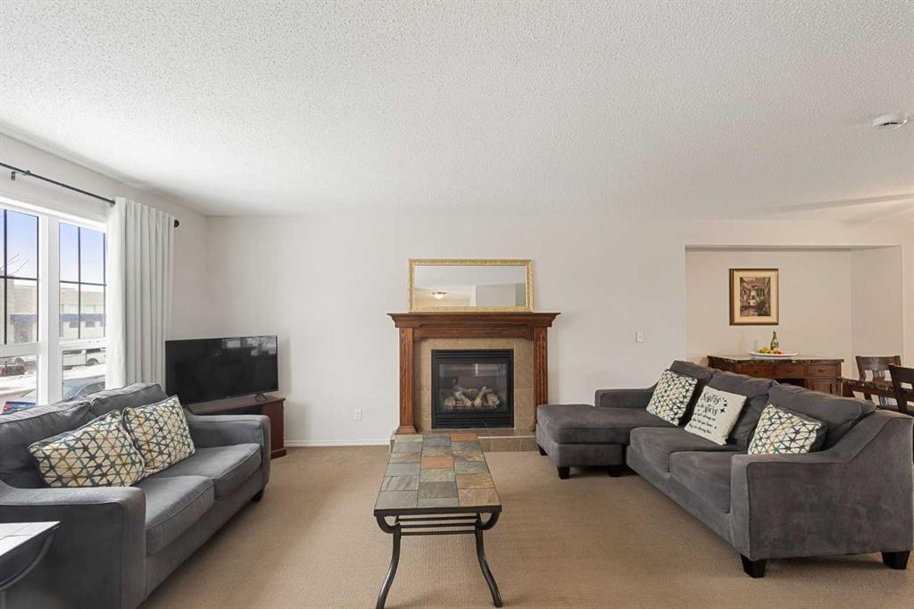 41 Silverado Saddle Avenue Sw, Calgary, AB - Indoor Photo Showing Living Room With Fireplace