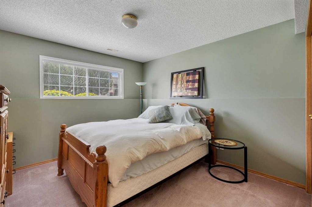 34 Hidden Spring Circle Nw, Calgary, AB - Indoor Photo Showing Bedroom