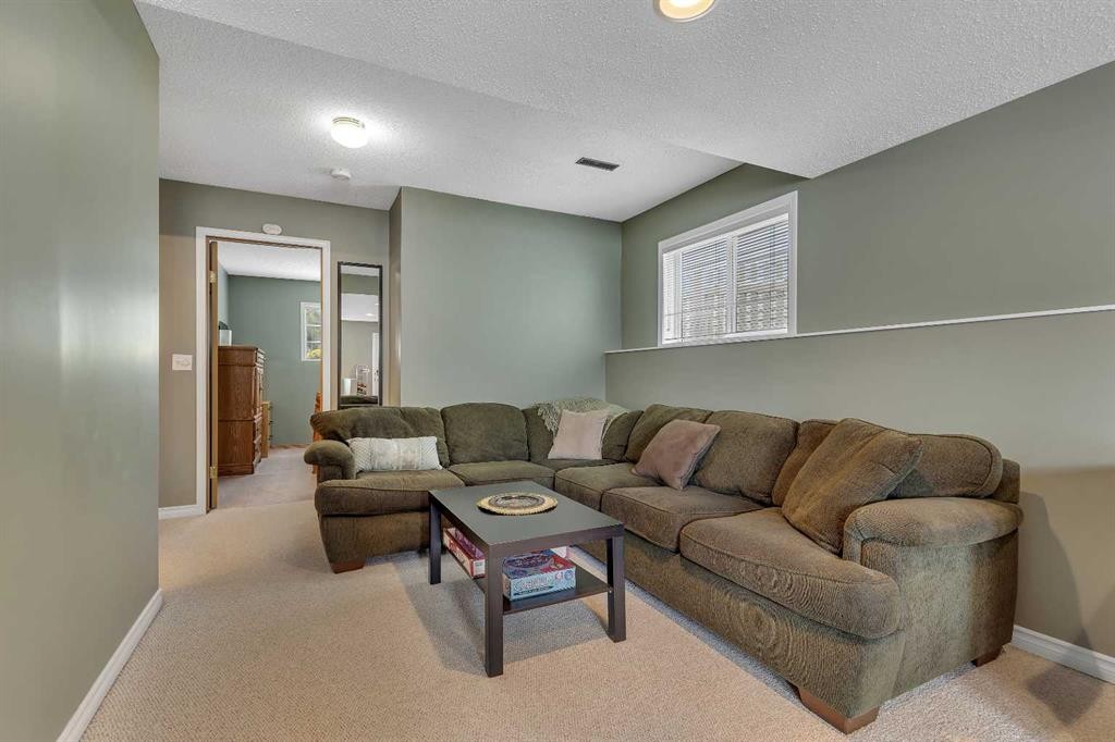 34 Hidden Spring Circle Nw, Calgary, AB - Indoor Photo Showing Living Room