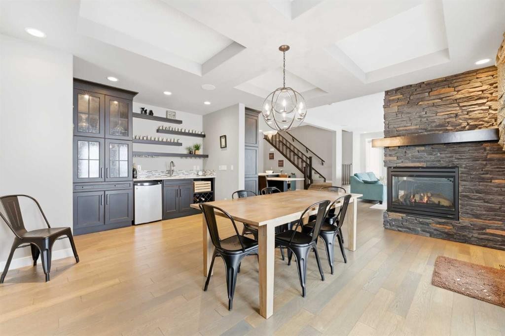 187 Cranarch Circle Se, Calgary, AB - Indoor Photo Showing Dining Room With Fireplace