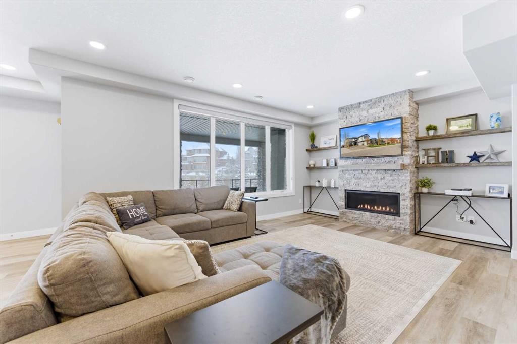 187 Cranarch Circle Se, Calgary, AB - Indoor Photo Showing Living Room With Fireplace