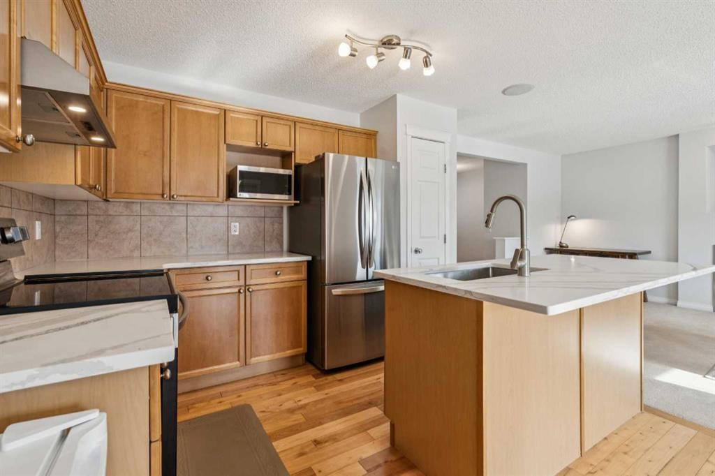 85 Silverado Range View Sw, Calgary, AB - Indoor Photo Showing Kitchen With Stainless Steel Kitchen
