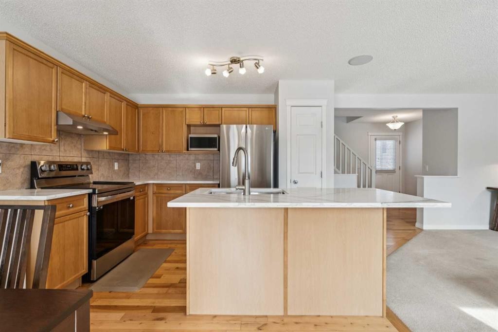 85 Silverado Range View Sw, Calgary, AB - Indoor Photo Showing Kitchen With Stainless Steel Kitchen