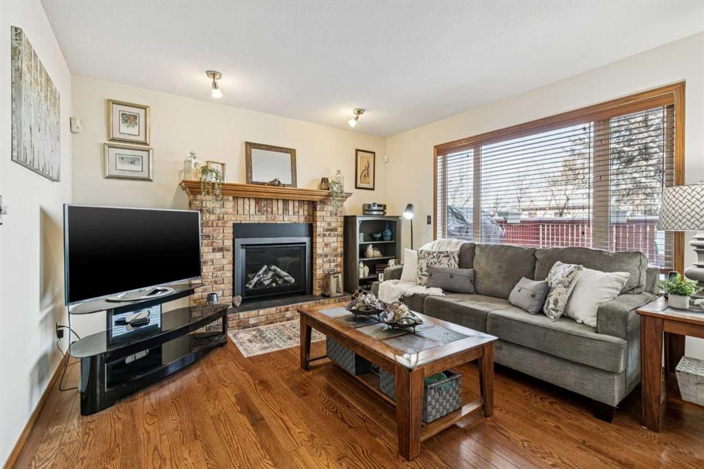 20 Macewan Ridge View Nw, Calgary, AB - Indoor Photo Showing Living Room With Fireplace