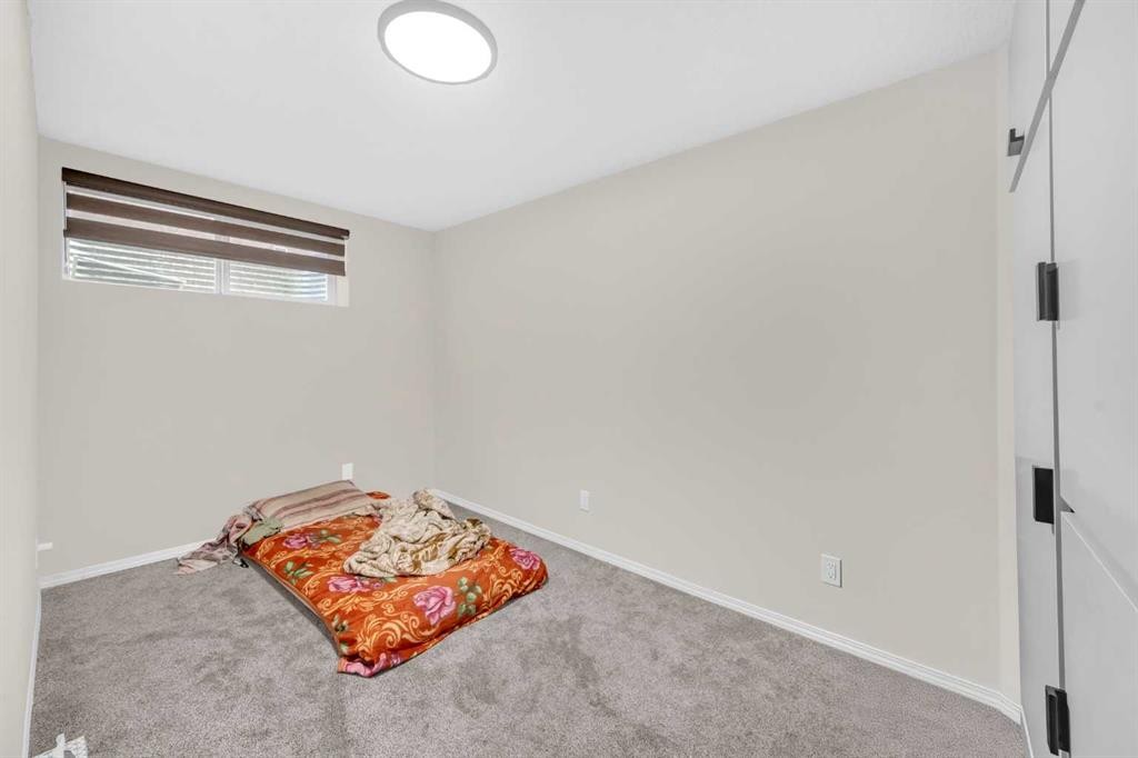 51 Coral Reef Close Ne, Calgary, AB - Indoor Photo Showing Other Room