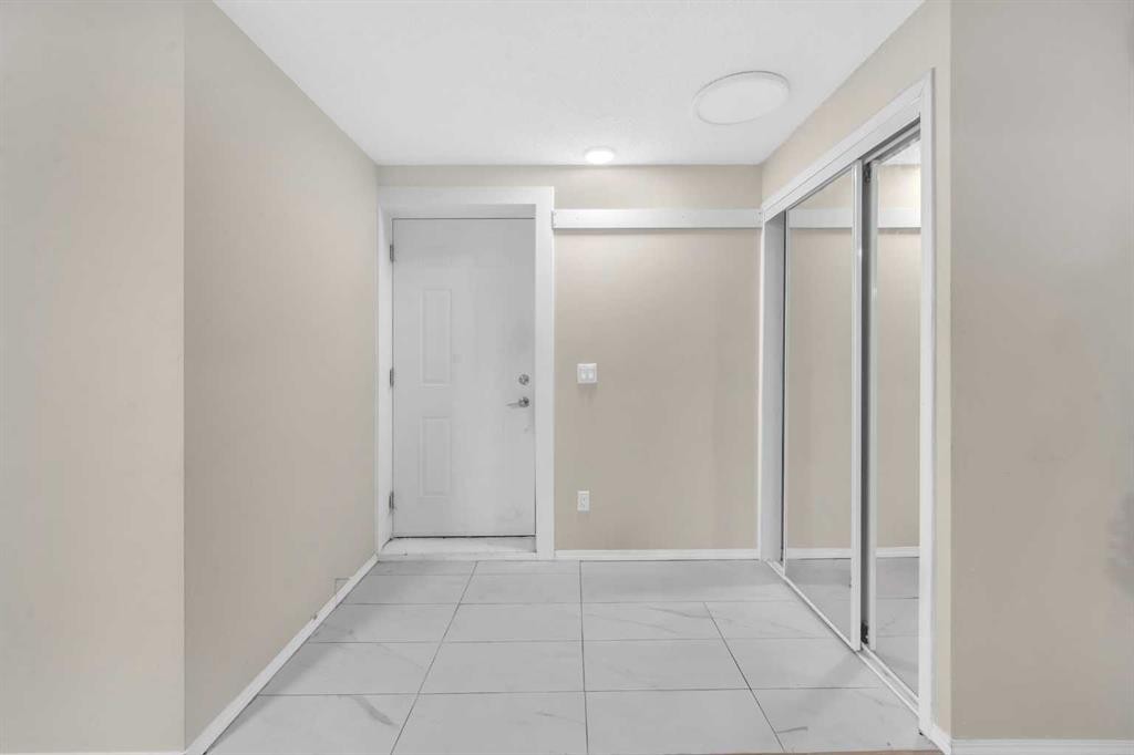 51 Coral Reef Close Ne, Calgary, AB - Indoor Photo Showing Other Room