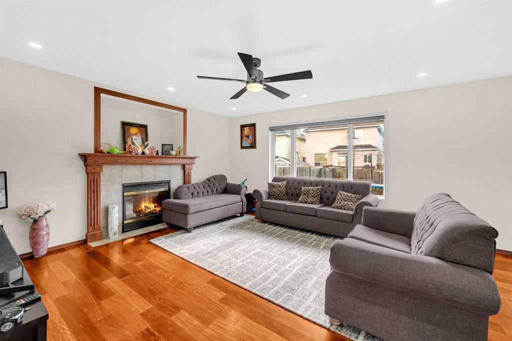 51 Coral Reef Close Ne, Calgary, AB - Indoor Photo Showing Living Room With Fireplace