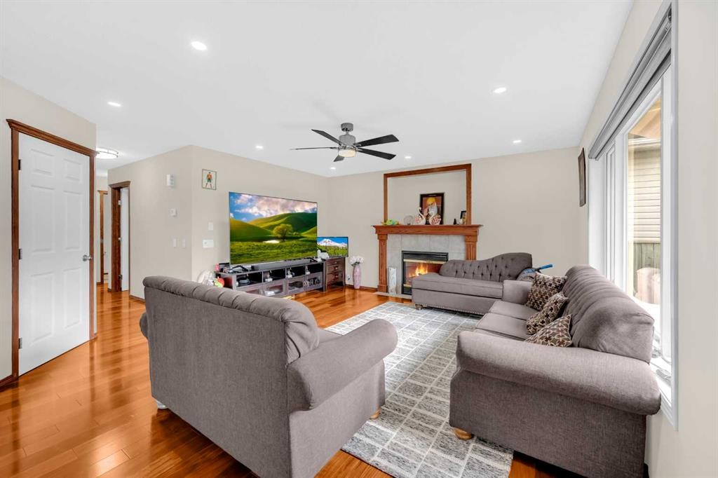 51 Coral Reef Close Ne, Calgary, AB - Indoor Photo Showing Living Room With Fireplace