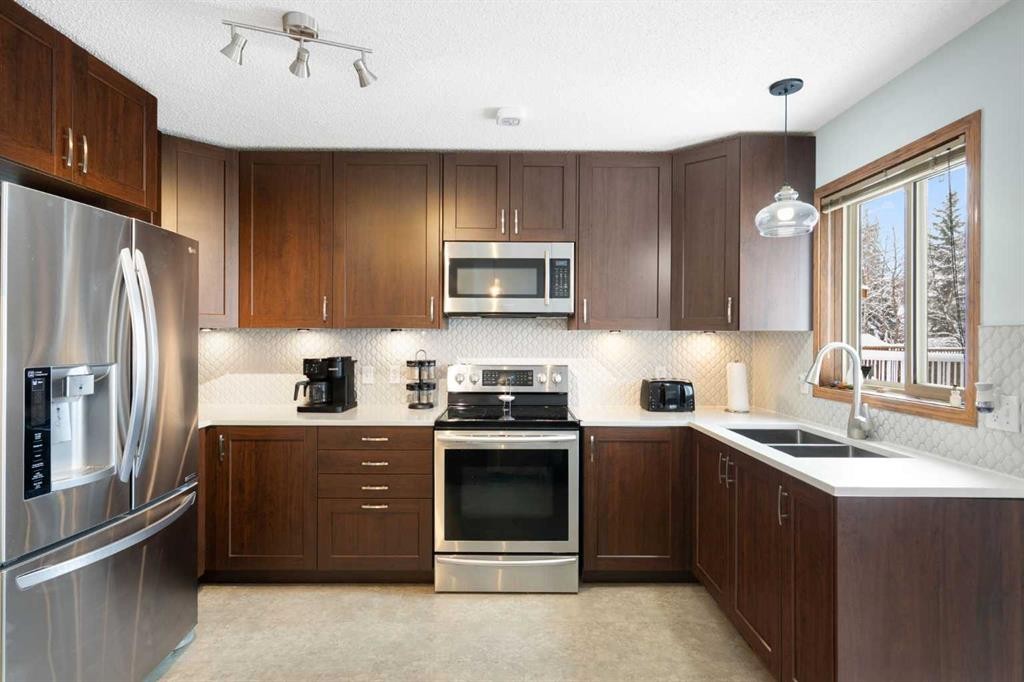 80 Chaparral Road Se, Calgary, AB - Indoor Photo Showing Kitchen With Double Sink With Upgraded Kitchen