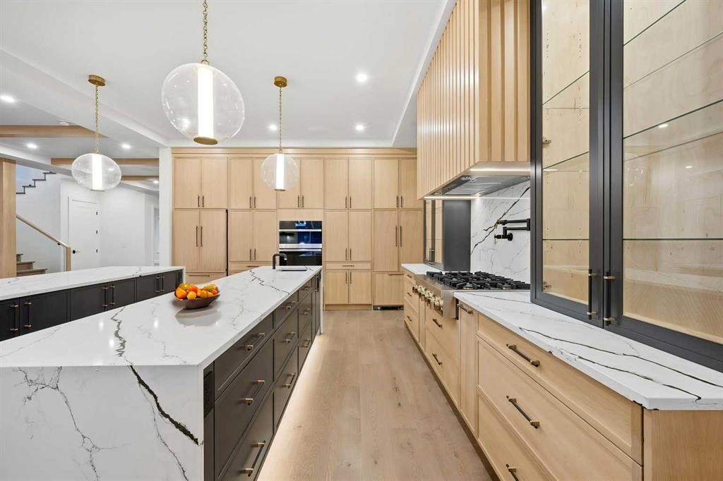 126 Sunstone Way, Balzac, AB - Indoor Photo Showing Kitchen With Upgraded Kitchen